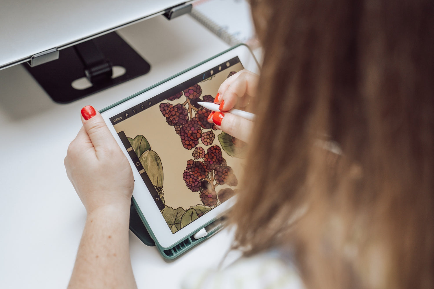 Debbie Poulton, illustrator at Brand and Feel, drawing a seasonal illustration for a country home wall art print composition